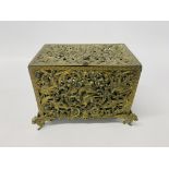 A HIGHLY DECORATIVE PIERCED BRASS CASKET WITH GRIFFIN & BIRD DETAIL, A HINGED LID AND FRONT PANEL,