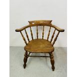 AN ANTIQUE SMOKERS BOW CHAIR WITH SHAPED ELM SEAT