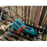 A BOSCH ROTAK 34R ELECTRIC LAWN MOWER AND BOSCH ART 23 SL ELECTRIC STRIMMER - SOLD AS SEEN