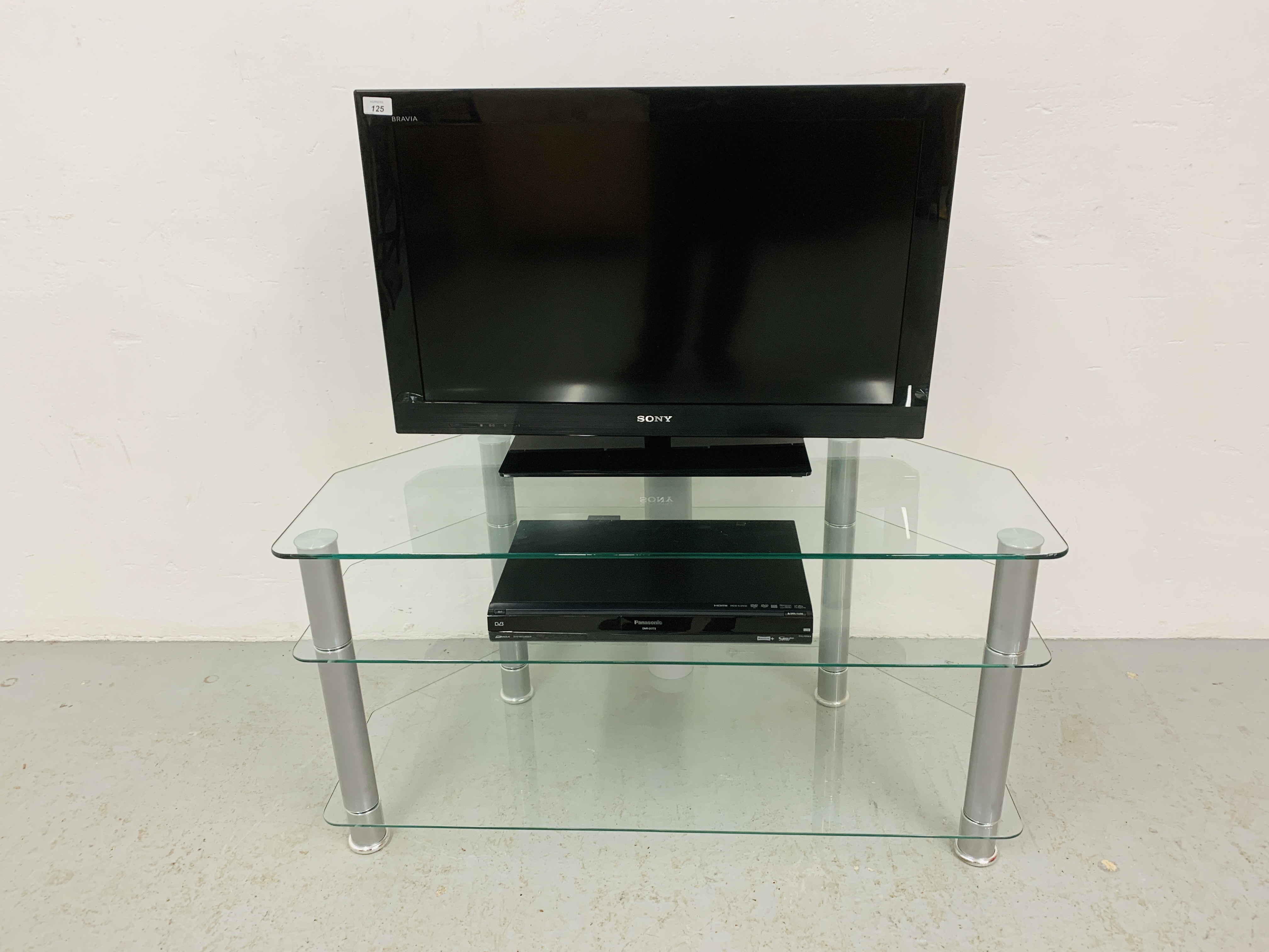A SONY BRAVIA 32 INCH TELEVISION WITH REMOTE AND PANASONIC DVD / HDD RECORDER WITH FREEVIEW,