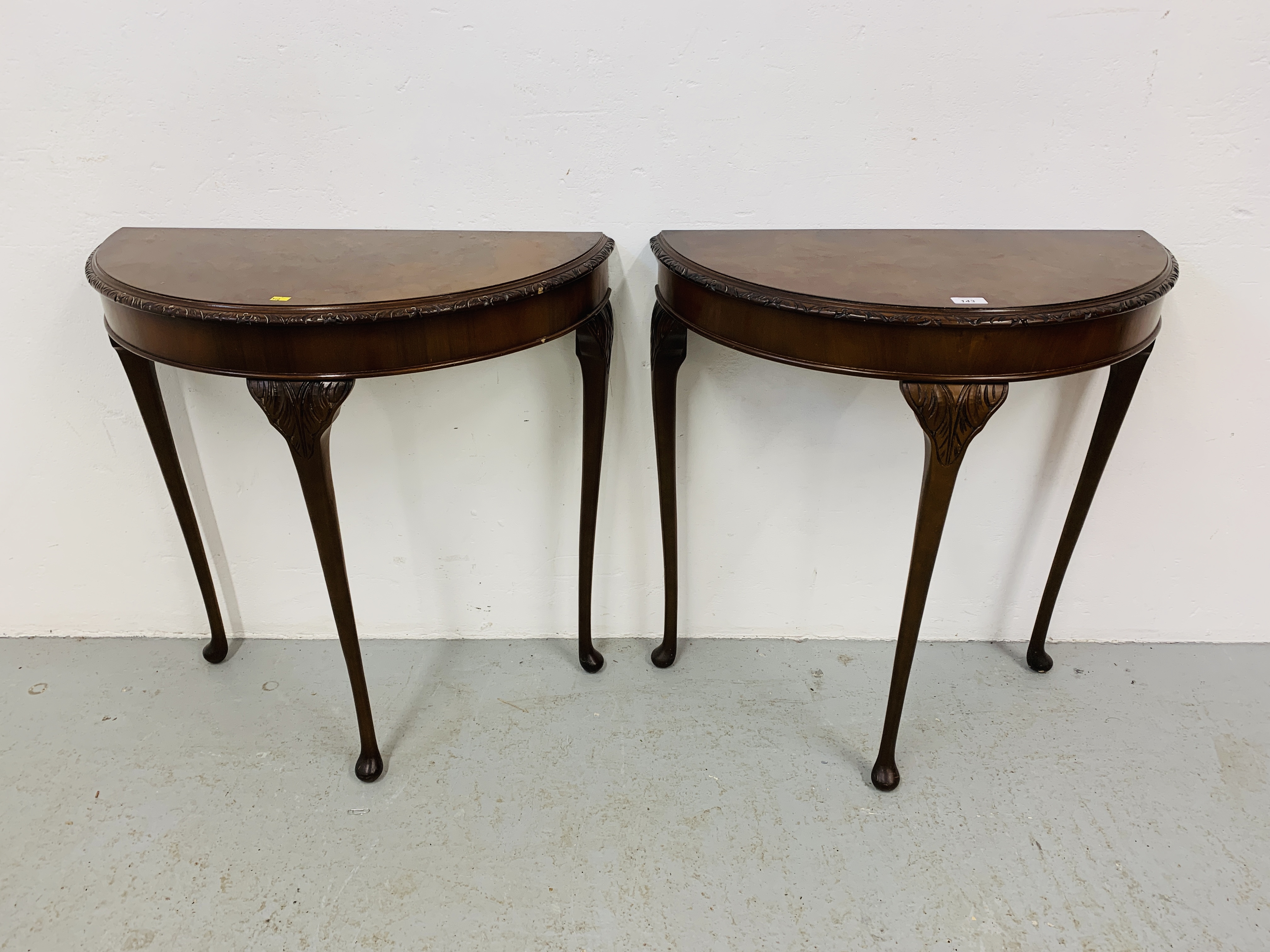 A PAIR OF REPRODUCTION WALNUT FINISH DEMI LUNE SIDE TABLES (EACH WIDTH 74cm)