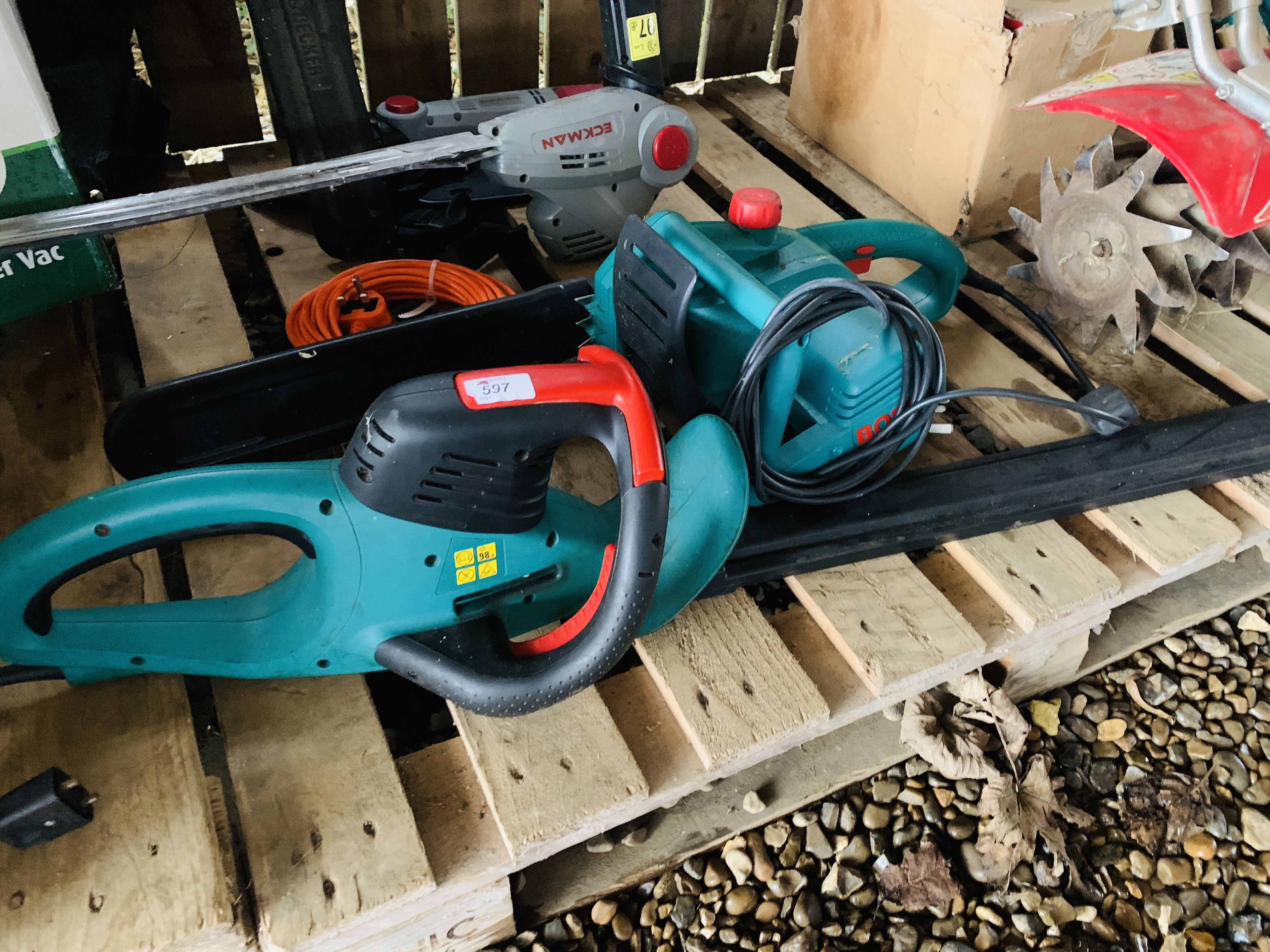 A BOSCH ELECTRIC CHAINSAW MODEL AKE 35 S AND A BOSCH ELECTRIC HEDGE TRIMMER MODEL AHS 7000-PRO-T -