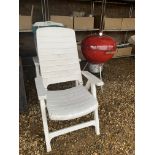 A WEBER KETTLE CHARCOAL BBQ AND TWO FOLDING GARDEN CHAIRS WITH CUSHIONS