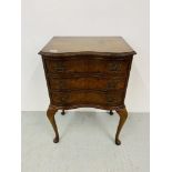A REPRODUCTION WALNUT FINISH SERPENTINE FRONTED THREE DRAWER CHEST ON LEGS. WIDTH 53cm. HEIGHT 78cm.