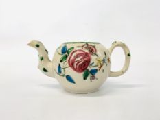 AN C18TH STAFFORDSHIRE SALTGAZED TEAPOT, DECORATED WITH LFOWERS,