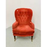 A REPRODUCTION RED VELOUR UPHOLSTERED BUTTON BACK EASY CHAIR