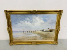 A GILT FRAMED OIL ON BOARD YARMOUTH FISHING BOATS ON BEACH BEARING SIGNATURE M. HURLEY 72CM X 47CM.