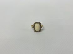 AN 18CT GOLD PLATINUM SET DIAMOND AND OPAL RING