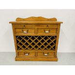 A COUNTRY PINE WINE RACK WITH FOUR DRAWERS,
