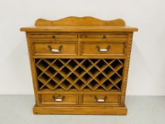 A COUNTRY PINE WINE RACK WITH FOUR DRAWERS,