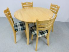 A BEECHWOOD CIRCULAR TOP DROP FLAP DINING TABLE AND FOUR CHAIRS - TABLE EXTENDED 1M DIAMETER
