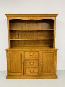 A COUNTRY PINE DRESSER,