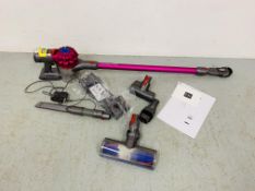 A DYSON V7 MOTORHEAD CORDLESS VACUUM CLEANER WITH CHARGER, WALL MOUNT,