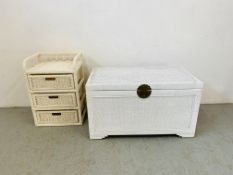 A WHITE PAINTED WICKER OTTOMAN. W 91CM. H 51CM. D 51CM. AND WHITE SEAGRASS THREE DRAWER RACK.