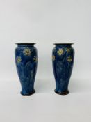 A PAIR OF DOULTON STONEWARE BLUE GLAZED VASES WITH DAISY DECORATION HEIGHT 26.