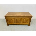 OAK BLANKET BOX WITH CARVED LINEN FOLD DETAIL TO PANELS.