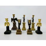 A group of French neo classical style plinths surmounted by eagle figures and Egyptian mythical