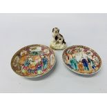 Two Chinese Qianlong polychrome saucers along with a C19th model of a spaniel (A/F)