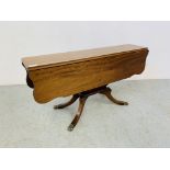 A REPRODUCTION MAHOGANY DROP FLAP OCCASIONAL TABLE WITH SHAPED TOP STANDING ON PEDESTAL BASE.