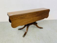 A REPRODUCTION MAHOGANY DROP FLAP OCCASIONAL TABLE WITH SHAPED TOP STANDING ON PEDESTAL BASE.