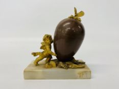 A French gilt metal and enamel egg, the cover with butterfly finial,