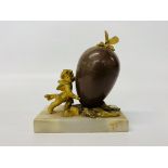 A French gilt metal and enamel egg, the cover with butterfly finial,