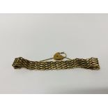 A 9CT GOLD GATE BRACELET WITH SAFETY CHAIN AND PADLOCK CLASP