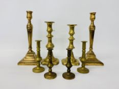 A pair of Georgian brass candlesticks in neo-classical style,