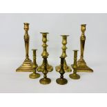 A pair of Georgian brass candlesticks in neo-classical style,