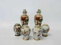 A pair of Chinese polychrome decorated baluster vases decorated with figures,
