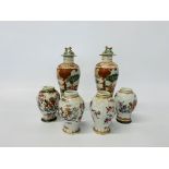 A pair of Chinese polychrome decorated baluster vases decorated with figures,