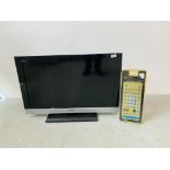 A SONY BRAVIA 32 INCH TELEVISION PLUS OVERSIZE REMOTE - SOLD AS SEEN