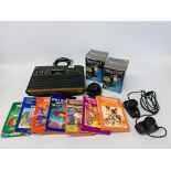 AN ATARI VIDEO COMPUTER SYSTEM WITH 7 GAMES AND 4 CONTROLLERS - SOLD AS SEEN