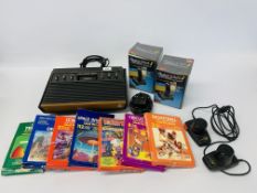 AN ATARI VIDEO COMPUTER SYSTEM WITH 7 GAMES AND 4 CONTROLLERS - SOLD AS SEEN