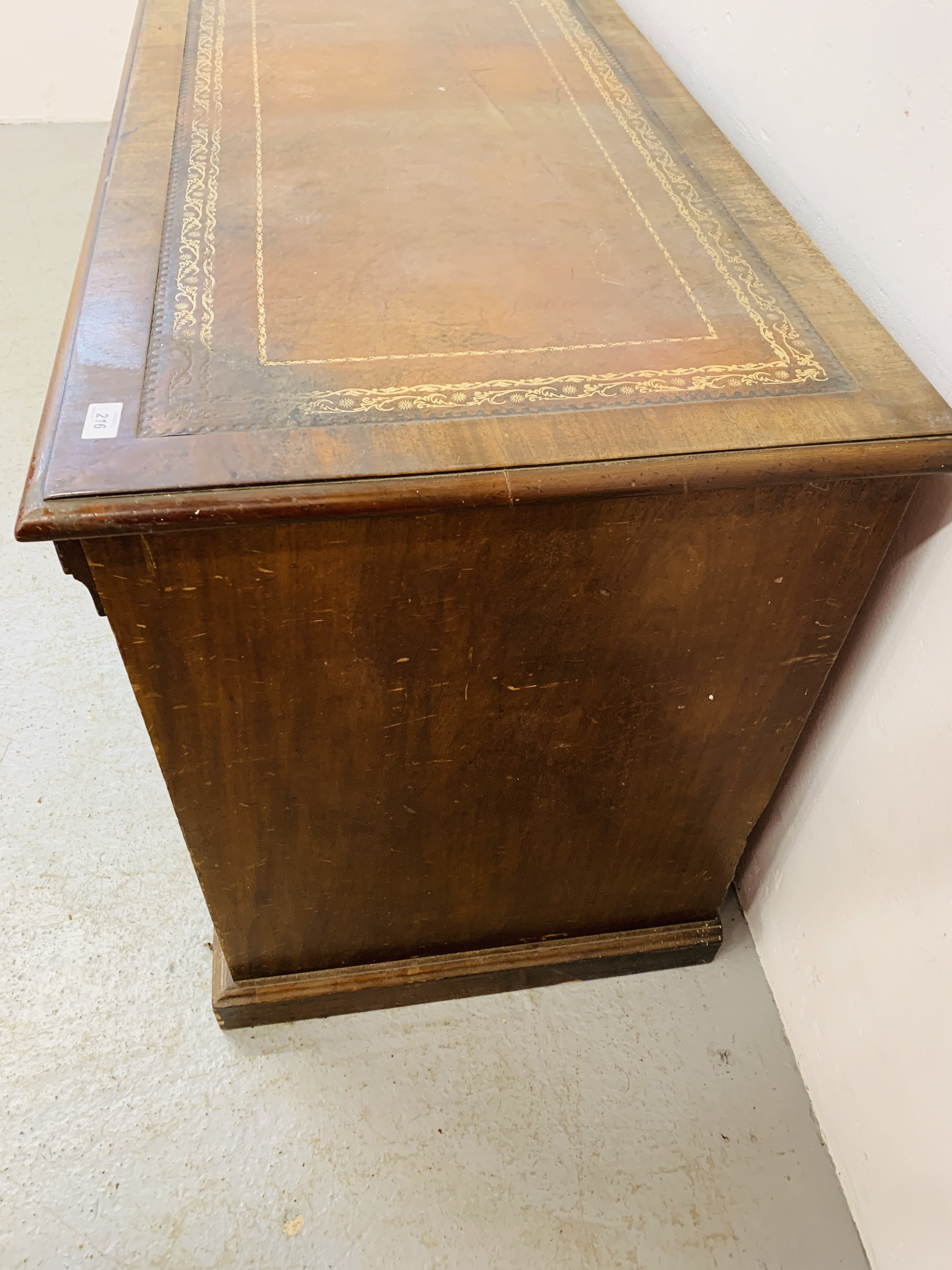 An Edwardian mahogany single piece nine drawer pedestal desk with inlaid tan leather top, - Image 14 of 18