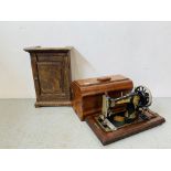 A VINTAGE JONES HAND OPERATED SEWING MACHINE ALONG WITH AN OAK VINTAGE SINGLE DOOR CABINET