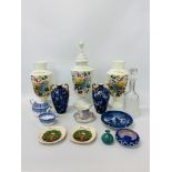AN OPAQUE GLASS LIDDED VASE AND MATCHING PAIR OF VASES WITH HAND PAINTED FLORAL DECORATION,