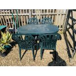 A GREEN UPVC GARDEN TABLE AND FOUR CHAIRS