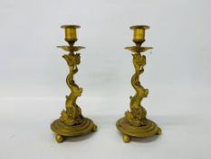 A pair of French gilt metal dolphin candlesticks, height 25.