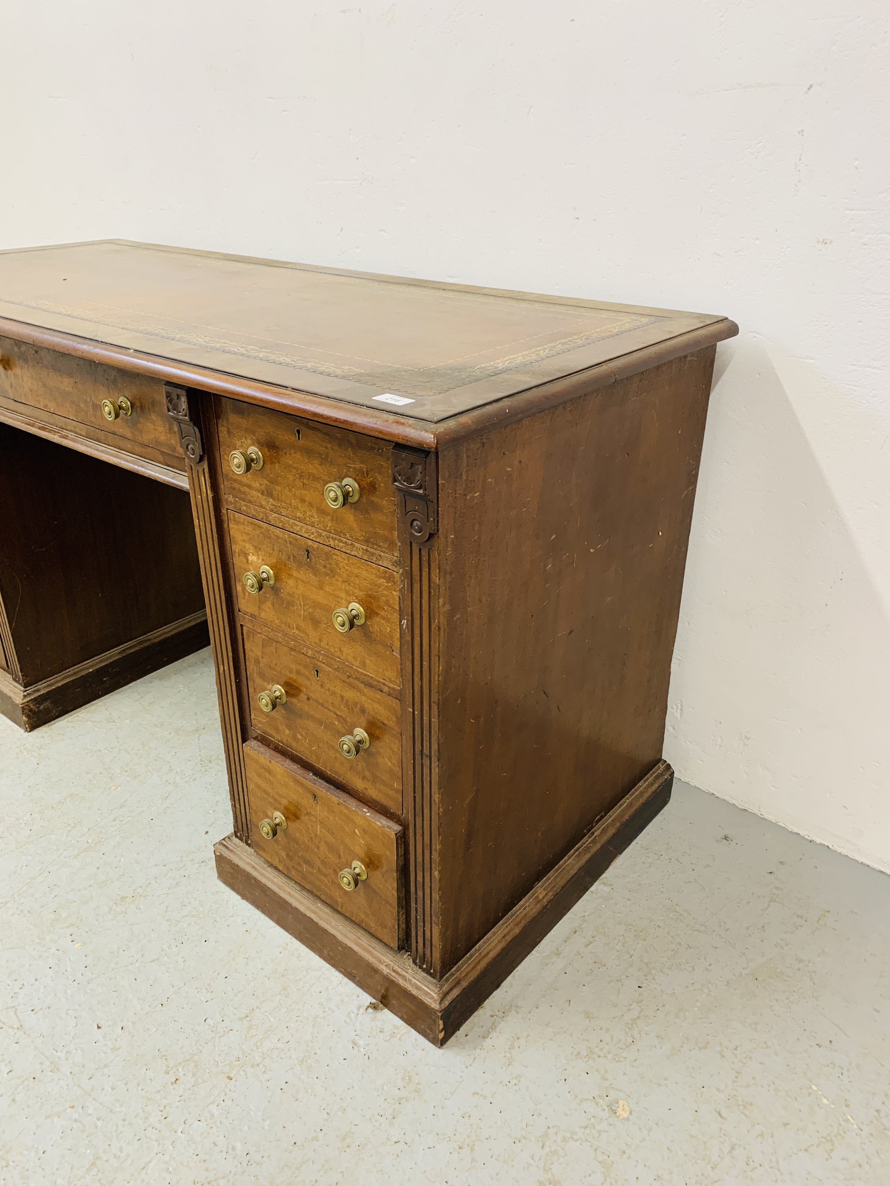 An Edwardian mahogany single piece nine drawer pedestal desk with inlaid tan leather top, - Image 4 of 18