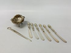 A Continental silver sweetmeat basket on tripod base along with a set of six silver tea knives