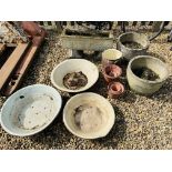 A STONEWORK PLANTING TROUGH, TWO STONEWORK BARREL STYLE PLANTERS,