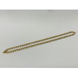 A 9CT GOLD CURB LINK NECKLACE LENGTH 56cm