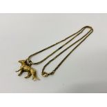 A 9CT GOLD ALSATIAN DOG PENDANT STRUNG FROM A 9CT GOLD FINE BOX LINK NECKLACE. LENGTH 60cm.