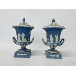 A pair of Wedgwood blue jasper urns and covers decorated with classical figures,
