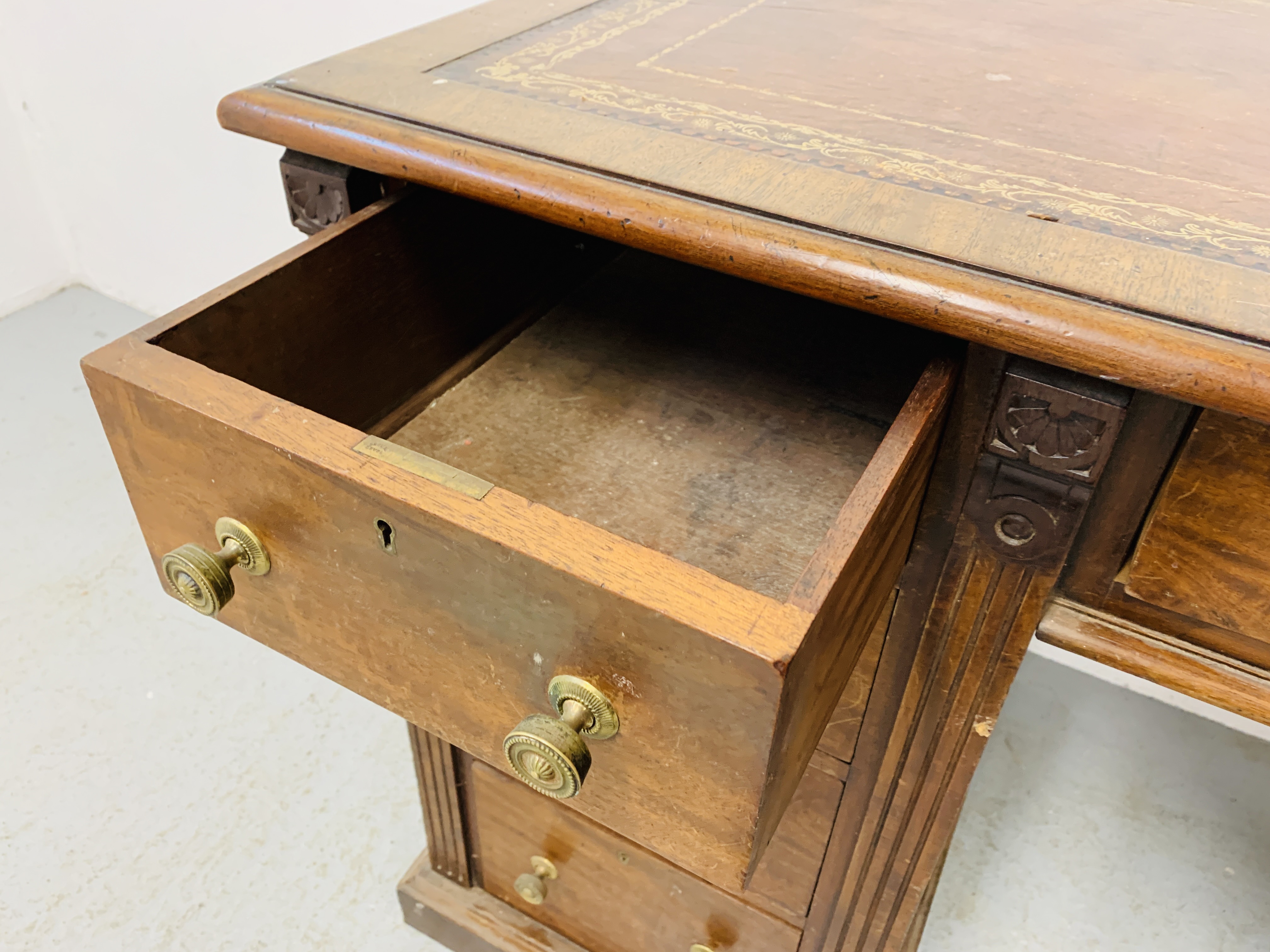 An Edwardian mahogany single piece nine drawer pedestal desk with inlaid tan leather top, - Image 17 of 18