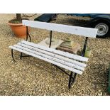 A SLATTED SEAT GARDEN BENCH WITH WROUGHT METAL ENDS