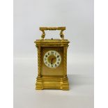 A HEAVY BRASS FOUR GLASS MANTEL TIME PIECE - THE DIAL MARKED L.