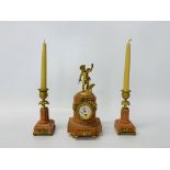 A C19th French pink marble and gilt metal clock garniture, the clock surmounted by cupid,