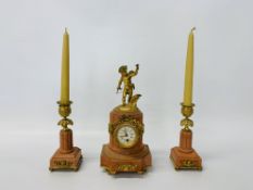 A C19th French pink marble and gilt metal clock garniture, the clock surmounted by cupid,